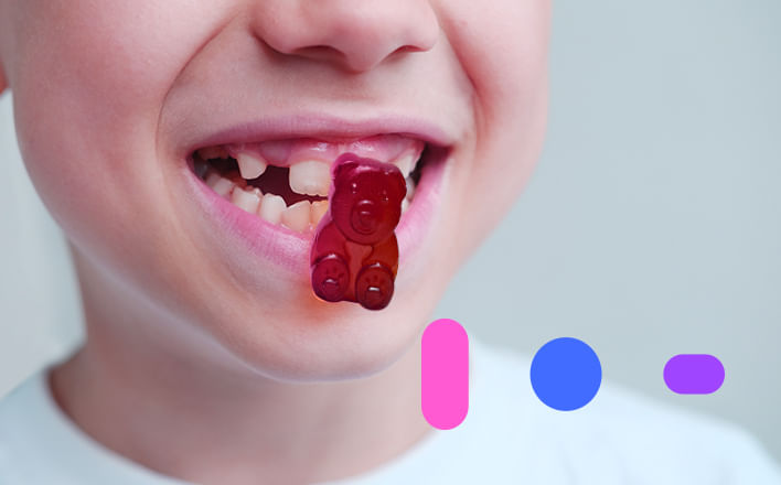 criança comendo gummy